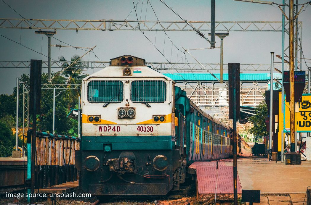 A feature image showing digital notification on a screen and a train in background, with the text 'RRB Group D Exam City Slip 2026 Out'
