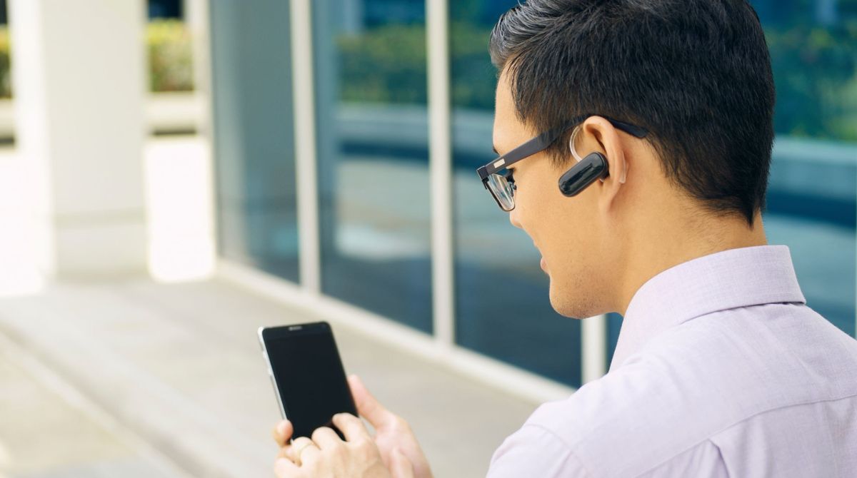 Image of a person turning on Bluetooth on a smartphone