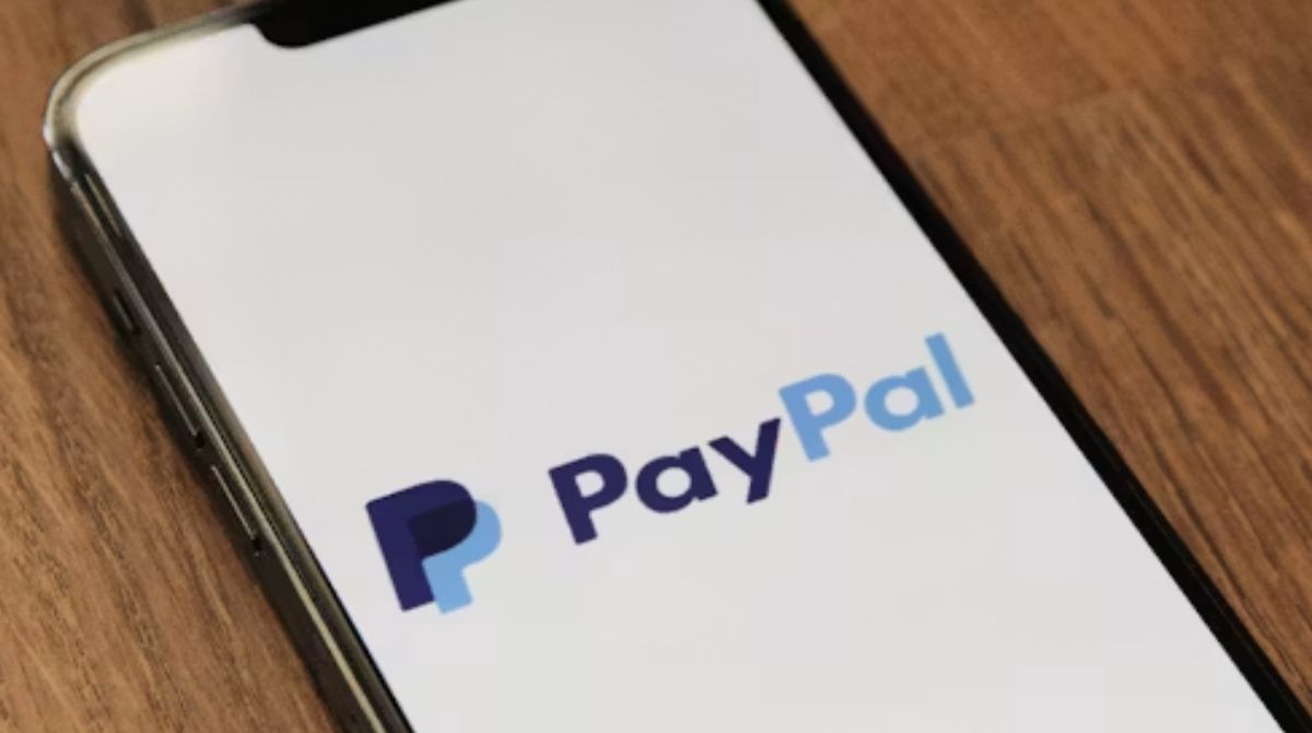PayPal logo on a building window, symbolizing the buzz about Stripe buying PayPal